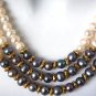 THREE STRAND PEARL NECKLACE WITH BLACK PEARLS AND GOLD ACCENTS