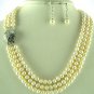 TRIPLE STRAND PEARL NECKLACE WITH EMBOSSED CLASP