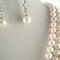 TRIPLE STRAND PEARL NECKLACE WITH EMBOSSED CLASP