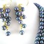 TRIPLE STRAND GREY PEARL NECKLACE WITH EMBOSSED CLASP
