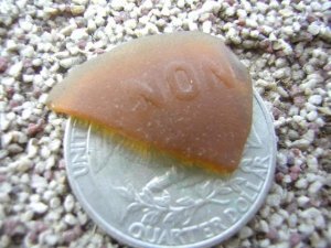 "NON" written Genuine  Amber Beach Sea Glass Pattern