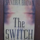 The Switch   by  Sandra Brown    Warner Books, 2000