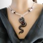 Set 9 Necklace and Earrings Snake With Skulls