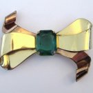 Retro goldtone & faux emerald bow brooch. Coro. 1940s.