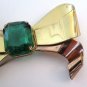 Retro goldtone & faux emerald bow brooch. Coro. 1940s.