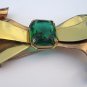Retro goldtone & faux emerald bow brooch. Coro. 1940s.