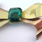 Retro goldtone & faux emerald bow brooch. Coro. 1940s.