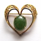 12k gold filled heart pin with a green cabochon stone