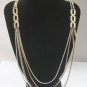 Long Gold Tone & White Enamel Multichain Runway Necklace, by Monet. c. 1970s
