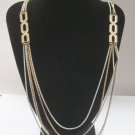 Long Gold Tone & White Enamel Multichain Runway Necklace, by Monet. c. 1970s