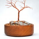 Copper tree in copper bowl
