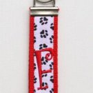 Black Paw Prints on Red Belt with Red Initial