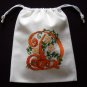 Letter D-cross stitch on 8"x 9"white denim drawstring pouch