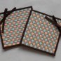 Plaid and bow-a set of two 11cm.x11.5 cm. woven coasters