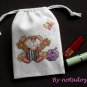 Little mouse and butterfly-cross stitch on 5"x7"white denim drawstring pouch