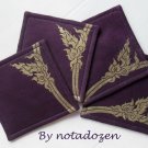 Nok Karb --a set of four 10cm.x10cm. gold color painted on violet linen coasters