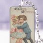 Vtg. Christmas children hug happy postcard 1 x 1.5" glass tile pendant necklace