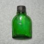 Green Glass Bottle With Planet With Ring Symbol & Plastic Cap With Glass Stirrer - Vintage