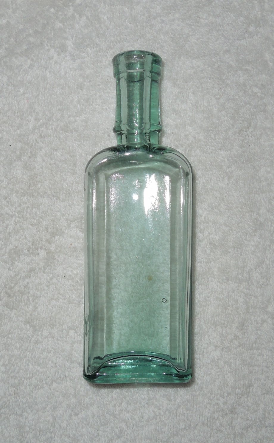 Clear Blue Glass Rectangular Paneled Bottle w/ Manufacturing Bubbles ...