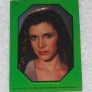Princess Leia - Endor Outfit - Sticker # 31 - Star Wars - Return Of The Jedi - Topps - 1983 - Green Princess Leia - Endor Outfit - Sticker # 31 - Star Wars - Return Of The Jedi - Topps - 1983 - Green
