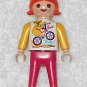 Playmobil - Be Free Girl Figure w/ Koala On Bicycle Logo - White / Pink / Orange - Vintage