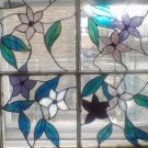 Old time wooden window frame with floral inserts