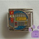 Movie Theater Italian Charm on a blue glitter disc