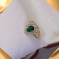 Classic Style Stunning Teardrop Lab-Created Emerald with Zircon Around Open Ring