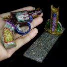 665CTS UNHEATED RHODOLITE GARNET, ZIRCON & SAPPHIRE GUN FIGURINE