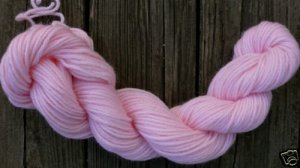 100%  wool yarn, worsted weight, soft pink,  1 skein