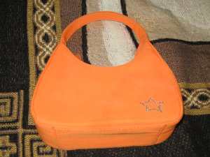 orange star-studded hand purse