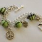 Green Tartan, Flower, Leaf and Peace Charms Bracelet