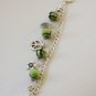 Green Tartan, Flower, Leaf and Peace Charms Bracelet