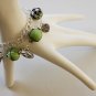 Green Tartan, Flower, Leaf and Peace Charms Bracelet