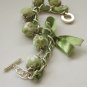 Apple green cotton beads and green satin ribbon bracelet