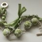 Apple green cotton beads and green satin ribbon bracelet