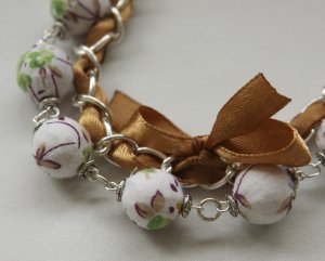 White floral cotton beads and brown satin ribbon bracelet