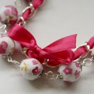 Cotton beads and pink satin ribbon bracelet