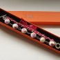 Cotton beads and pink satin ribbon bracelet