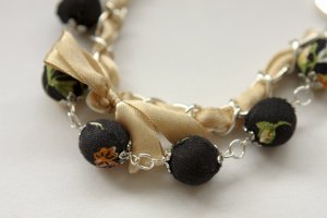 Cotton beads and beige satin ribbon bracelet