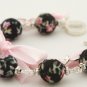 Black floral cotton beads and rose satin ribbon bracelet