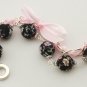 Black floral cotton beads and rose satin ribbon bracelet