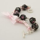 Black floral cotton beads and rose satin ribbon bracelet