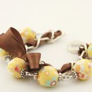 Yellow floral cotton beads and brown satin ribbon bracelet