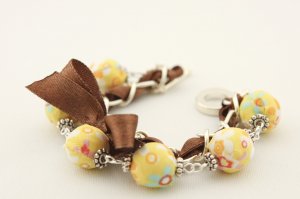 Yellow floral cotton beads and brown satin ribbon bracelet