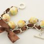 Yellow floral cotton beads and brown satin ribbon bracelet