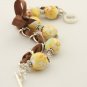 Yellow floral cotton beads and brown satin ribbon bracelet