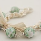 Light green floral cotton beads and beige satin ribbon bracelet
