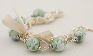 Light green floral cotton beads and beige satin ribbon bracelet
