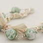 Light green floral cotton beads and beige satin ribbon bracelet